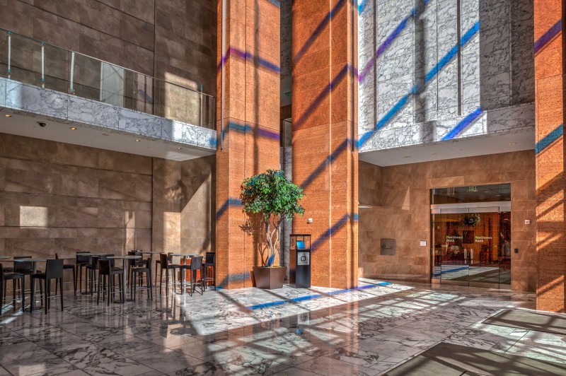 Lobby of the building if you enter frm 3rd Avenue. Walk towards Northwest Bank and follow the hallway around the corner