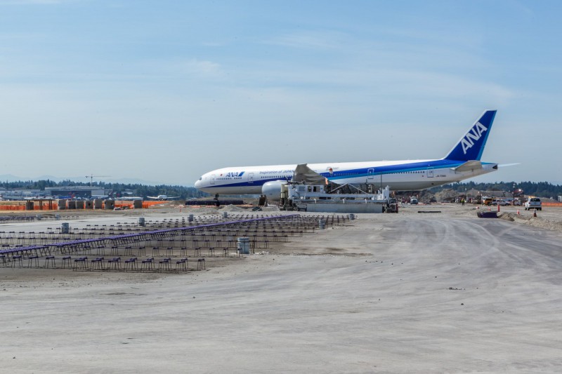 ANA Boeing 777 crossing the center runway.
